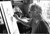 Beat artist Robert Levine sketching Joseph Logan in Allen Ginsberg's study. 